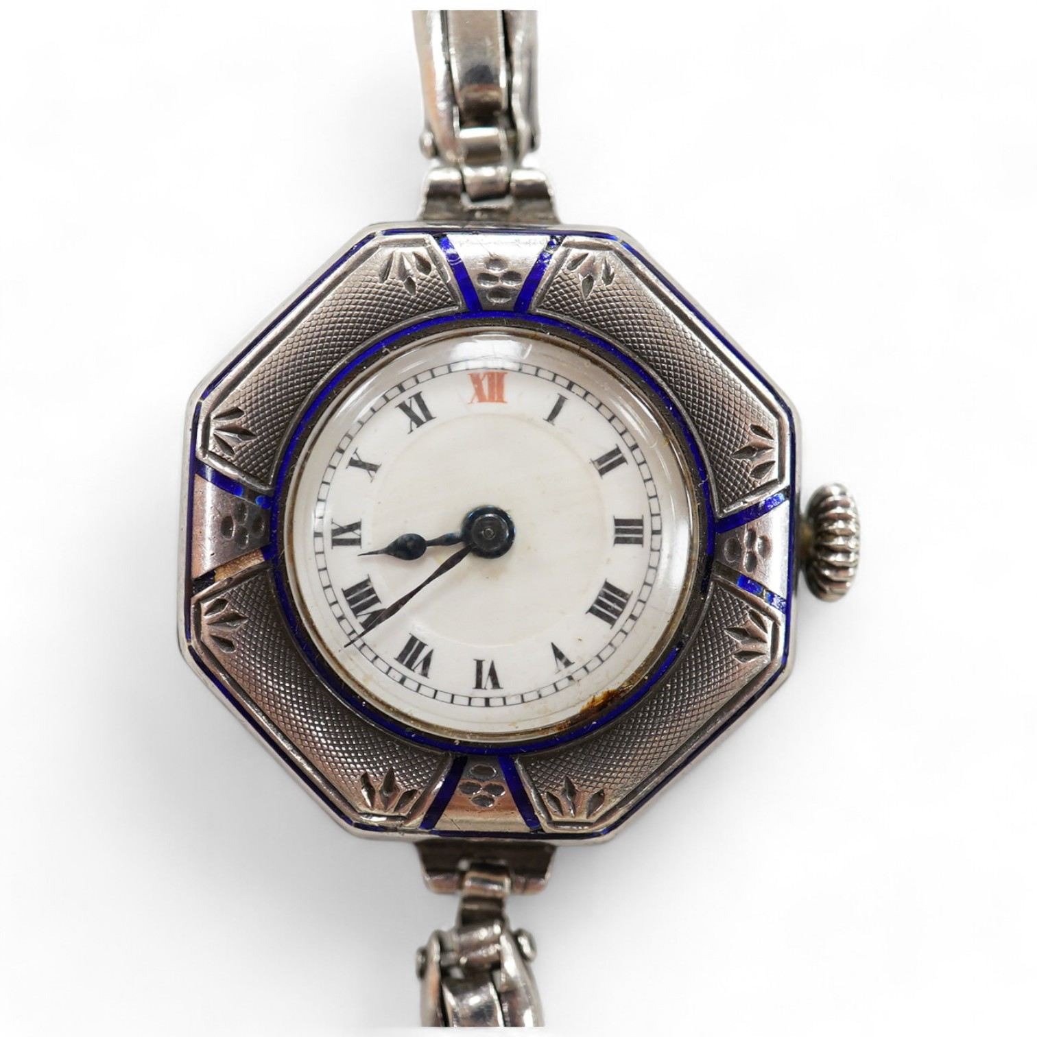 A lady's early 20th century continental sterling and enamel octagonal manual wind wrist watch, on a sterling expanding bracelet, 16.8cm. Condition - poor to fair